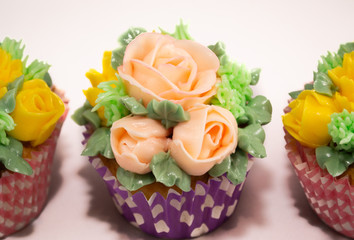 Baked homemade cupcakes with buttercream flowers