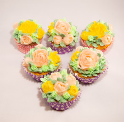 Baked homemade cupcakes with buttercream flowers