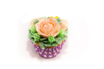 Baked homemade cupcakes with buttercream flowers