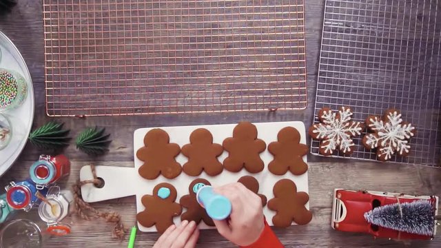 Step by step. Flat lay. Decorating gingerbread cookies with royal icing.