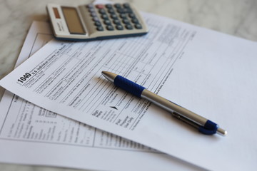 Tax Forms calculator pen paper finance business 