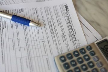 Tax Forms calculator pen paper finance business 