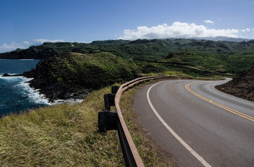 Maui Scenic Highway:  The Honoapiilani Highway passes beside a rocky coastline and curves into the mountains at the northwest end of Maui.