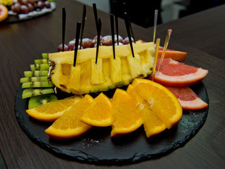 Fruit sliced on a plate.