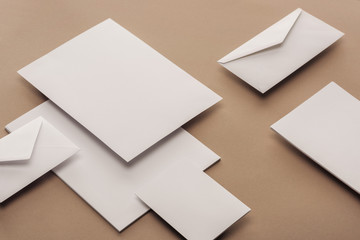 Empty sheets of paper, envelopes and cards with copy space