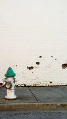 teal hydrant on wall