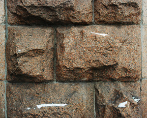 Background huge stones, granite wall brown.