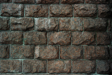 Background huge stones, granite wall brown.