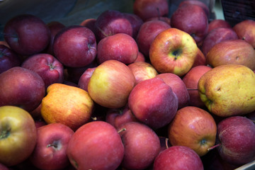ripe red apples on the counter in the supermarket