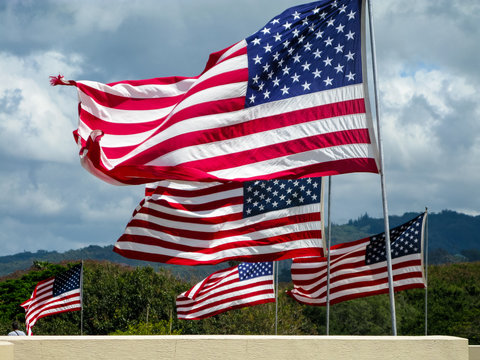 American flags flying over punchbowl crater memorial