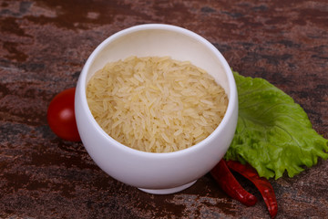 Raw uncooked rice in the bowl