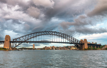 Sydney Harbor Bridge at sunset on a cloudy day, Australia