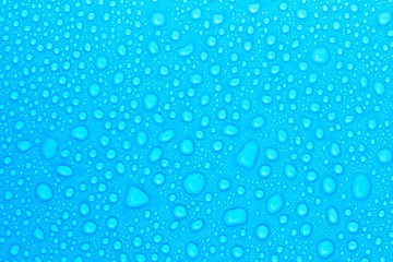 Obraz na płótnie Canvas closeup drops water on blue background