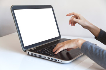 Working on a laptop with isolated white screen