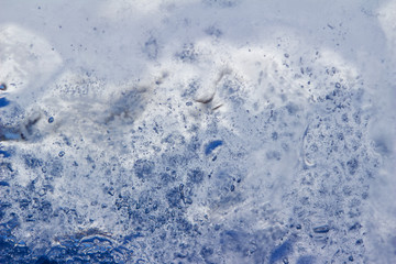 Whimsical macro abstract art background of frozen water condensation on a glass window in winter 