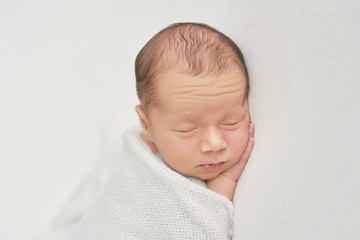 newborn boy on white background