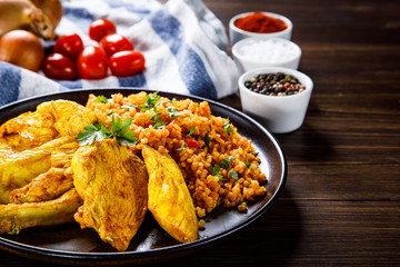 Roasted meat, groats and vegetables