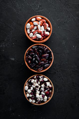 Raw beans in a bowl. Top view. Free copy space.
