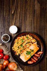 Roast salmon with groats and vegetables