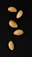 almonds on a black background 
