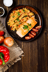 Roast salmon with groats and vegetables