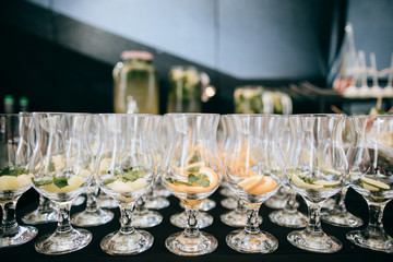 Many glasses for drinks on the wedding table
