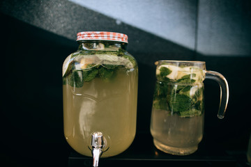 A bottle of cold lemonade on a wedding table
