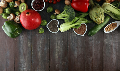 Healthy food clean eating selection. fruit, vegetable, seeds, superfood, cereals, leaf vegetable on rustic background