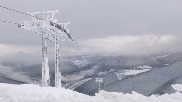 Time lapse of a mountain top ski lift in the Chleb mountains.