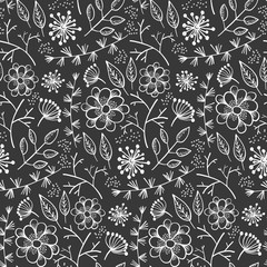 Monochrome floral seamless pattern with outline doodle white flowers and leaves on black background. Lovely floral texture with blossoms and herbs for textile, wrapping paper, surface, wallpaper