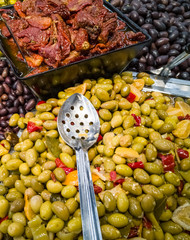 Pile of different sorts of olives and pickles on Mediterranean market