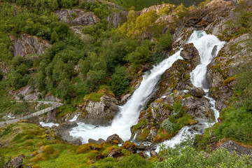 Obraz na płótnie Canvas Kleivafossen waterfall in Briksdalsbreen, Norway
