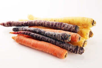 pile of carrots. Crate of mixed fresh harvested colorful carrot.