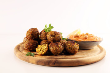 Traditional homemade hummus, falafel and chickpea served with spices on table. Jewish Cuisine.