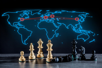 a world map with marked power centers, chess pieces symbolize the struggle for power
