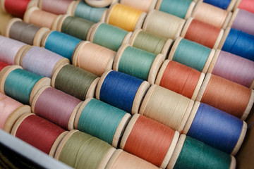 rolls of colorful threads, close-up and top view.