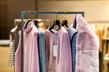 Fashion stylish luxury clothes display. Image and stylish services, selection of colors, types. Capsule spring wardrobe in pink tones