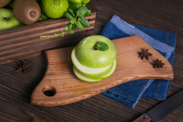 Set of green fruits for healthy diet and detox: apple, lime, kiwi, mango, carambola and mint.