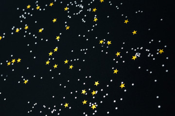 stars on a black paper background