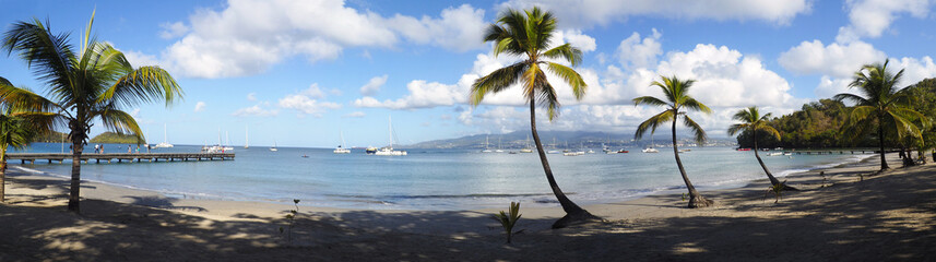 Superb panoramic view of the beautiful beach of Anse à l'Ane near the village of Trois-Ilets in Martinique facing the city of Fort-de-France