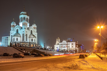 Urban Christian temple on a winter night, illuminated by spotlights. Temple-on-the-Blood, Yekaterinburg, Russia