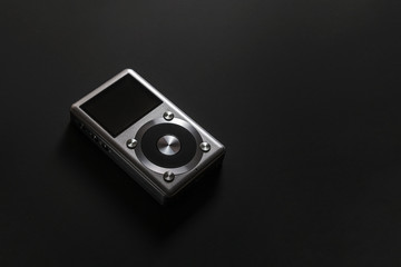 gray hi-fi portable music player on a black background mp3 flac dsd