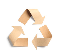 Recycling symbol cut out of kraft paper on white background, top view