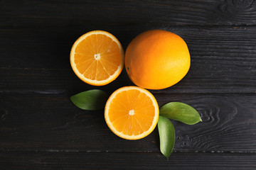 Flat lay composition with fresh oranges on wooden table