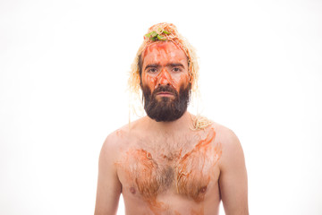 Bearded, funny, young man with spaghetti on his head, white background, body, dirty