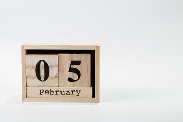 Wooden calendar February 05 on a white background