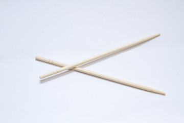 Chinese sticks on a gray background. View from above