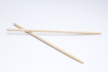 Chinese sticks on a gray background. View from above