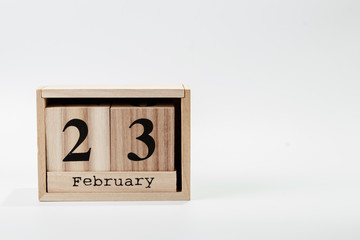 Wooden calendar February 23 on a white background