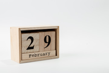 Wooden calendar February 29 on a white background